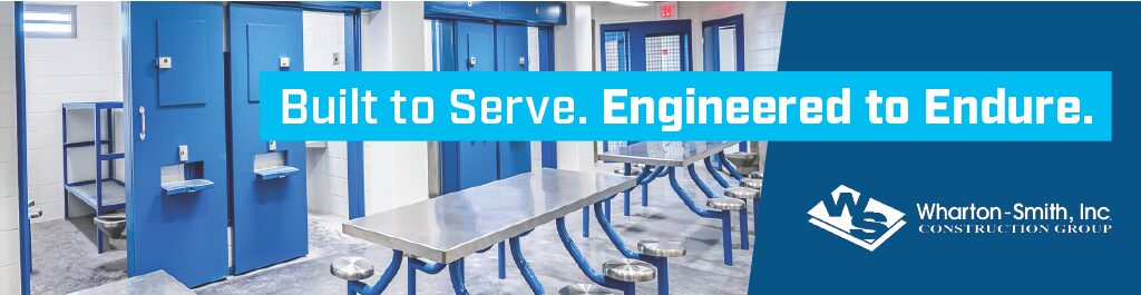 Interior of a detention facility with secure blue doors and stairways, featuring the message “Built to Serve. Engineered to Endure.”